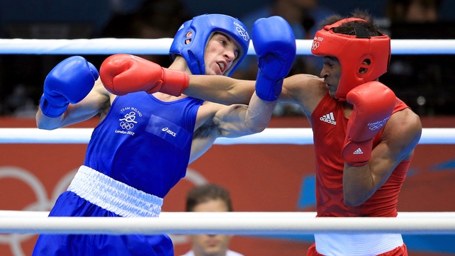 Luke Campbell stands between John Joe Nevin and gold