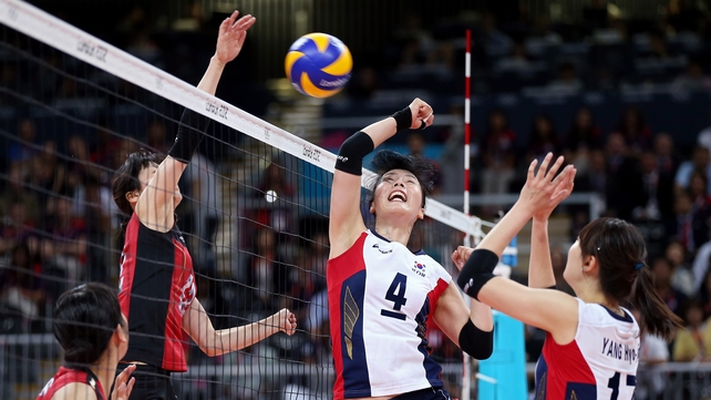 Saori Kimura of Japan (left) scores a point against Sa-Nee Kim of Korea