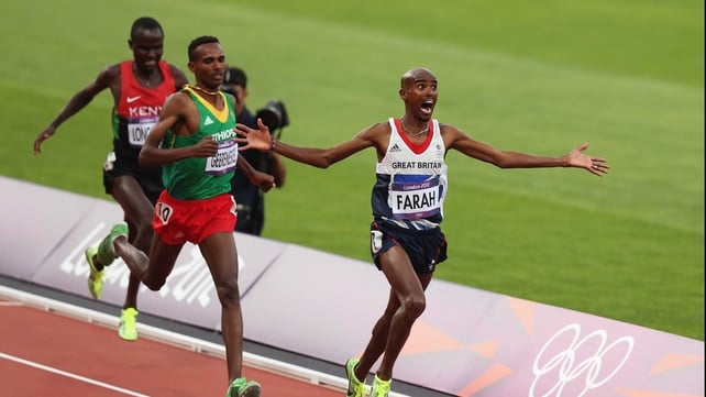 Mohamed Farah of Great Britain crosses the finish line to win gold