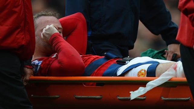 Rooney being stretchered off the Old Trafford pitch on 25 August