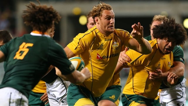 Scott Higginbotham pushes through the Springbok defence to score Australia's first try