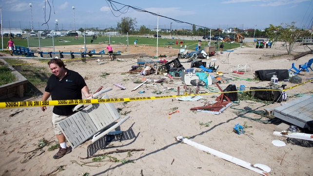 Residents of the New York borough of Queens clean up after the storms Residents of the New York borough of Queens clean up after the storms