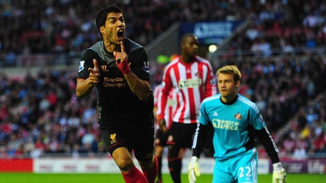 Luis Suarez looks unlikely to leave Anfield