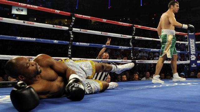 Matthew Macklin (r) knocks down Joachim Alcine in the first round of their middleweight fight at the Thomas & Mack Centre, Las Vegas