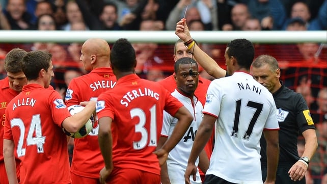 Referee Mark Halsey shows Jonjo Shelvey a red card in the Anfield clash against Manchester United