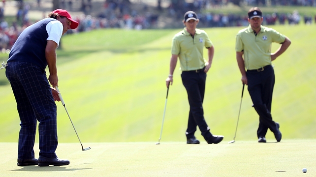 Phil Mickelson and playing partner Keegan Bradley proved too strong for Irish pair Rory McIlroy and Graeme McDowell in the afternoon fourballs