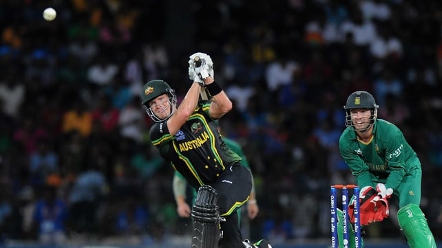 Shane Watson drives towards the boundary