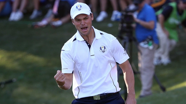 Martin Kaymer celebrates after he putts to retain the Ryder Cup