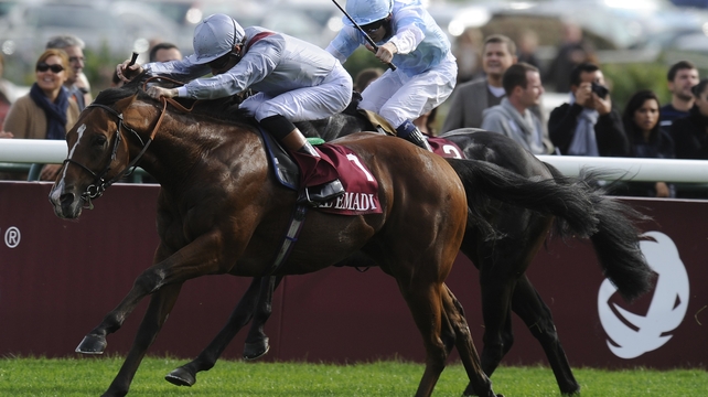 Richard Hughes riding Olympic Glory to victory at Longchamp