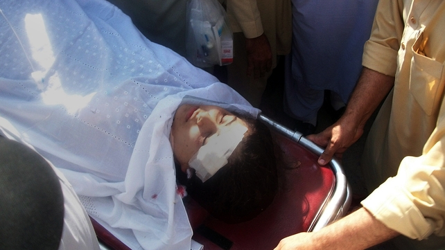 Pakistani hospital workers carry injured Malala Yousafzai, 14, on a stretcher at a hospital following an attack by gunmen in Mingora Pakistani hospital workers carry injured Malala Yousafzai, 14, on a stretcher at a hospital following an attack by gunmen in Mingora