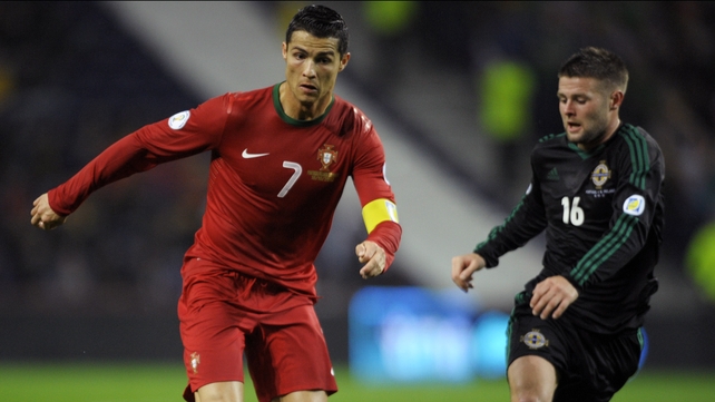 Cristiano Ronaldo is tracked by Northern Ireland's Oliver Norwood