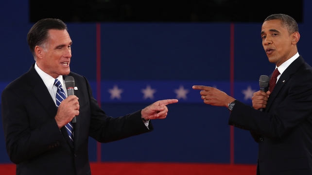 Mitt Romney and Barack Obama talk to each other during the debate at Hofstra University Mitt Romney and Barack Obama talk to each other during the debate at Hofstra University