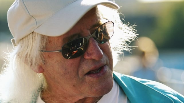 Jimmy Savile used his celebrity status to 'hide in plain sight', the report said Jimmy Savile used his celebrity status to 'hide in plain sight', the report said