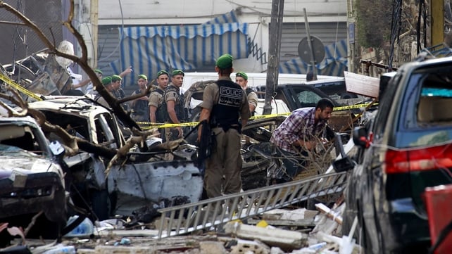 Police comb through the wreckage following yesterday's car bomb explosion in central Beirut Police comb through the wreckage following yesterday's car bomb explosion in central Beirut