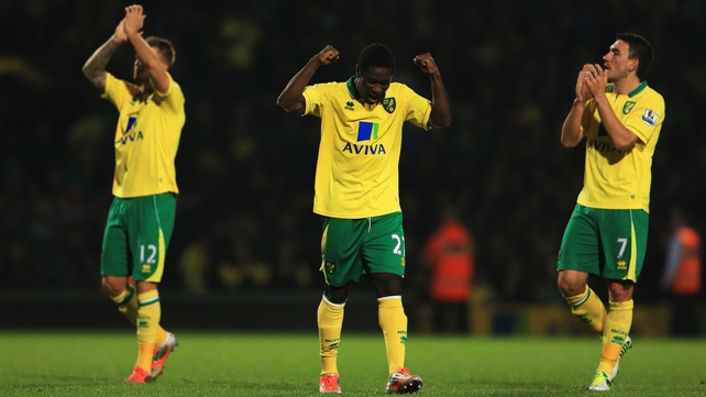 Anthony Pilkington, Alex Tettey and Robert Snodgrass celebrate at the final whistle