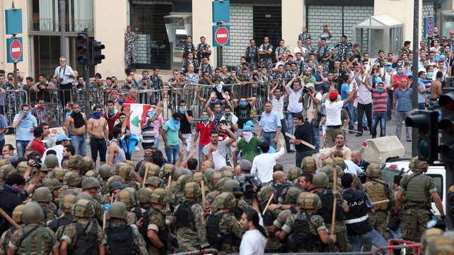 Protesters face off with Lebanese security forces as they try to storm the Government Palace in Beirut Protesters face off with Lebanese security forces as they try to storm the Government Palace in Beirut