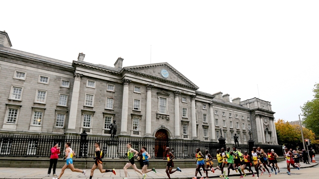 The elite runners go past Trinity College in conditions that were ideal throughout
