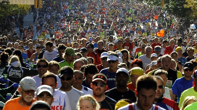 Runners make their way up 1st Avenue in Manhattan during the 2011 New York City Marathon