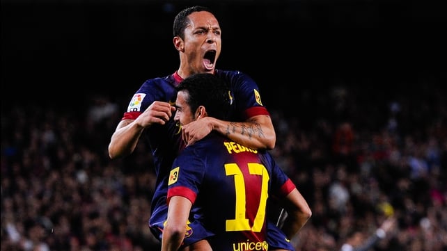 Adriano Correia of Barcelona celebrates with team-mate Pedro Rodriguez of after scoring his side's opening goal