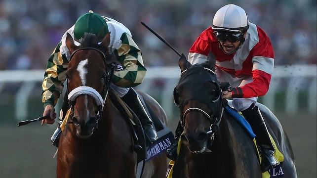 Fort Larned (red) just holds off the determined effort of Mucho Macho Man