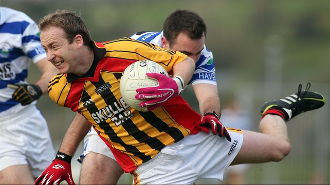 Michael Reidy of Dromcollogher- Broadford attempts to avoid Castlehaven's Mark Cahalane