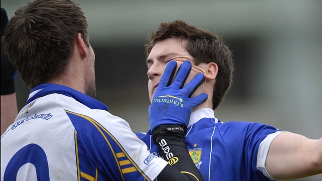 Gareth McKinless of Ballinderry gets to grips with Ciaran McGinley of Errigal Ciaran