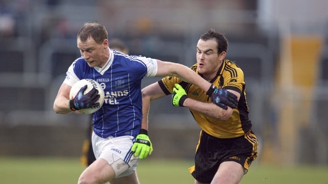 Anthony Thompson of Naomh Conaill is chased by Mark McGowan of St Eunan's