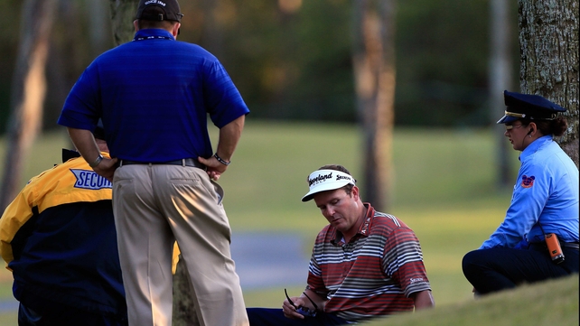 Charlie Beljan speaks with medics on the 17th hole