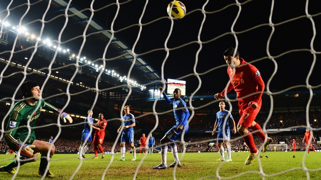 Luis Suarez heads home Liverpool's equaliser
