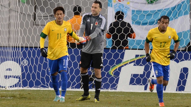 Take your points and the goals will come - Colombia keeper David Ospina offers his condolences to a nauseous-looking Neymar after his penalty miss