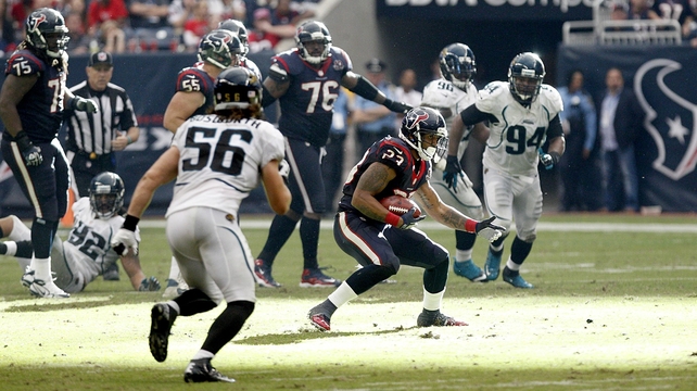 Arian Foster of the Houston Texans gaining some yardage against the Jacksonville Jaguars