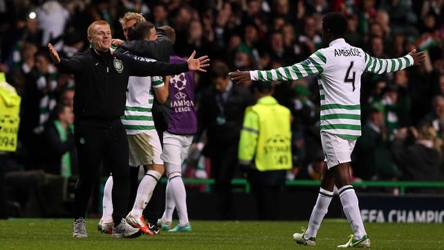 Neil Lennon (L) celebrates Celtic's crucial victory over Barcelona