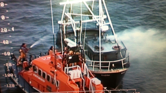 The Dunmore East Lifeboat attempts to extinguish the fire on the 'Kingfisher' (Pic: Irish Coastguard) The Dunmore East Lifeboat attempts to extinguish the fire on the 'Kingfisher' (Pic: Irish Coastguard)