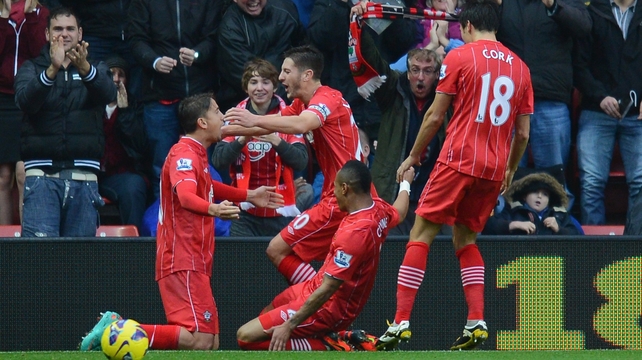 Adam Lallana (c) celebrates his opening goal