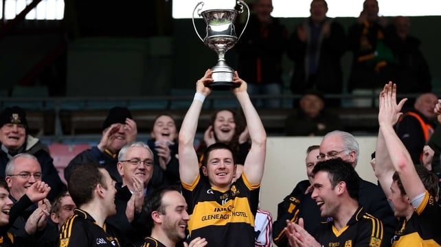Kieran O'Leary lifts the trophy for the Munster champions