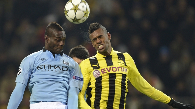 Mario Balotelli (left) and Dortmund's Brazil defender Felipe Santana