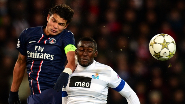 PSG's Thiago Silva (L) vies with Porto's forward Jackson Martinez