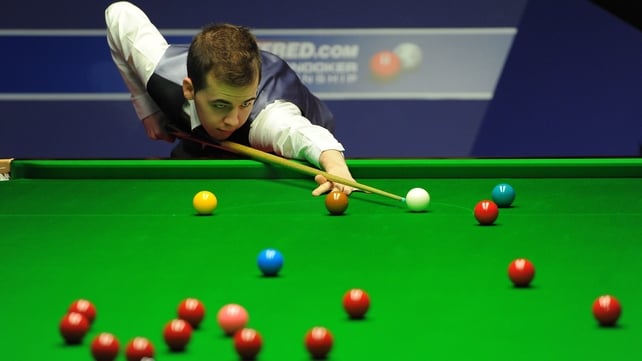 Luca Brecel was three frames behind before coming back to win 6-4