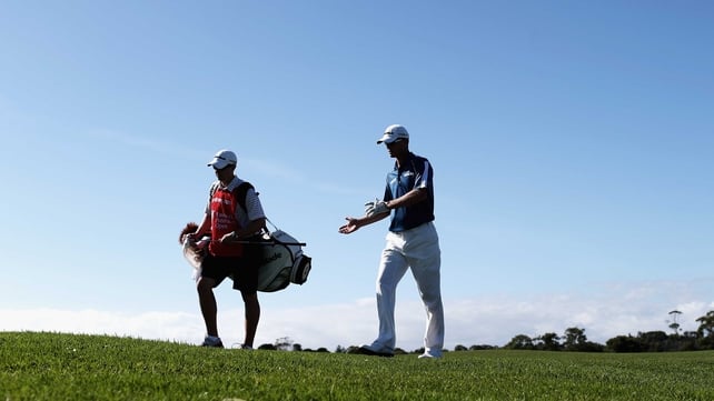 John Senden and his caddie during round one