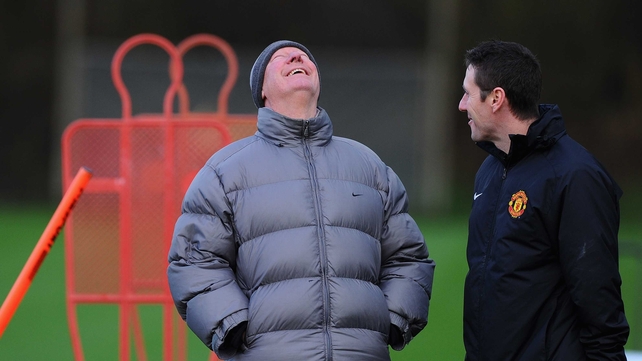 Alex Ferguson shares a joke during a training session this week at Carrington