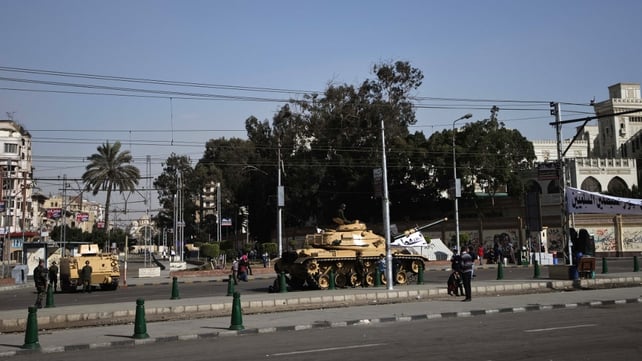 An Egyptian armoured personnel carrier and tank are deployed outside the presidential palace in Cairo An Egyptian armoured personnel carrier and tank are deployed outside the presidential palace in Cairo