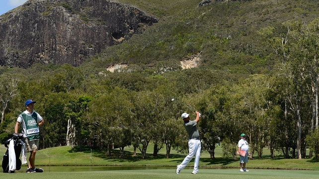 Leader Daniel Popovic playing a shot at the Palmer Coolum Resort's 13th hole