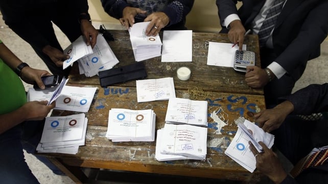 Polling station officials count ballots in Cairo Polling station officials count ballots in Cairo