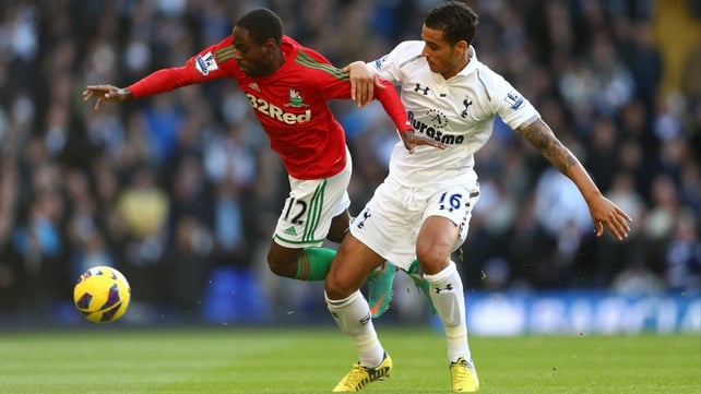 Nathan Dyer of Swansea City and Kyle Naughton of Tottenham Hotspur
