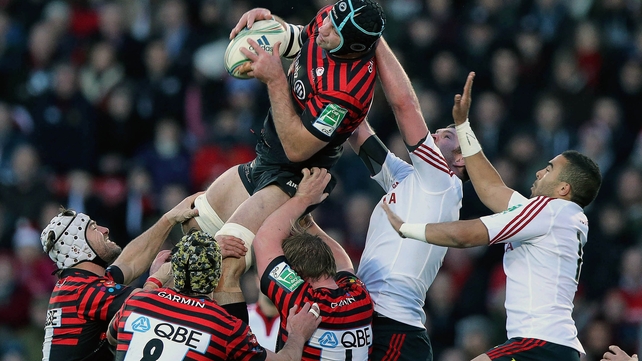 Donnacha Ryan and Simon Zebo of Munster watch Steve Borthwick claim the ball in the air