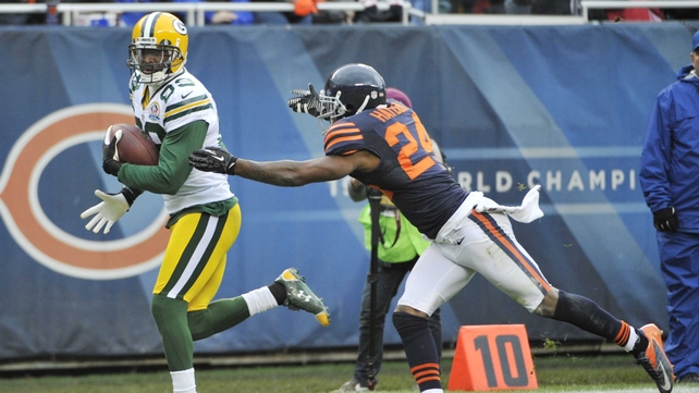James Jones of the Green Bay Packers catches a touchdown as Kelvin Hayden of the Chicago Bears defends him at Soldier Field