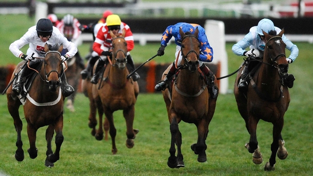 Barry Geraghty riding Mossley (left) clears the last to win The Albert Bartlett Novices' Hurdle Race at Cheltenham