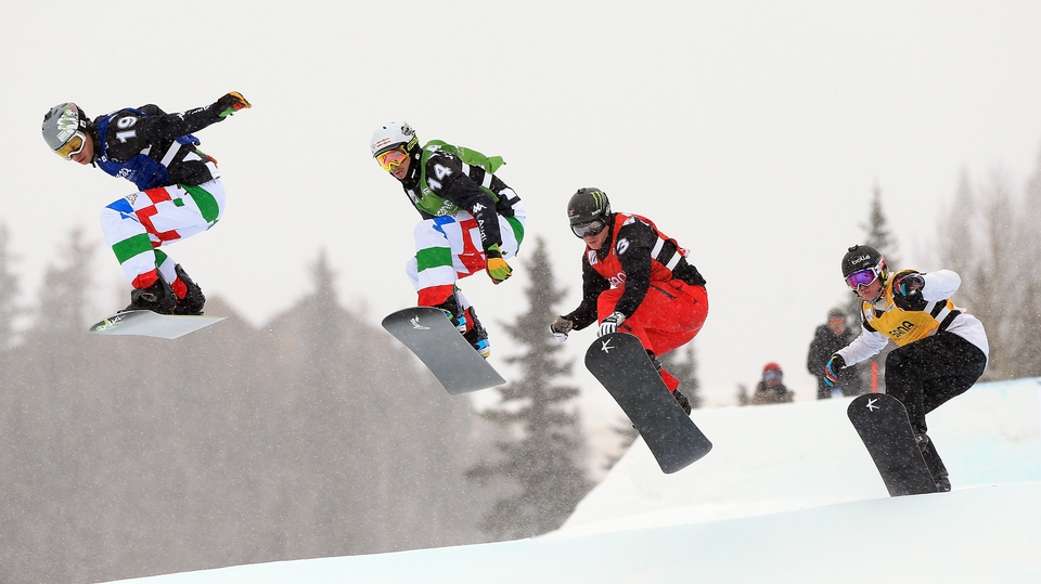 Italy's Omar Visintin and Luca Matteotti, Nate Holland of the USA and Jarryd Hughes of Australia compete at the USANA Snowboardcross World Cup in Telluride, Colorado