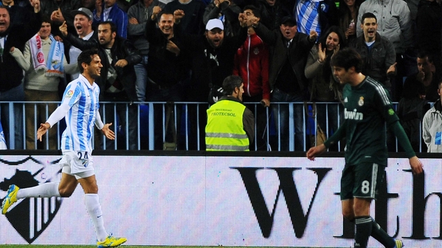 Roque Santa Cruz scored twice for Malaga against out of sorts Real Madrid