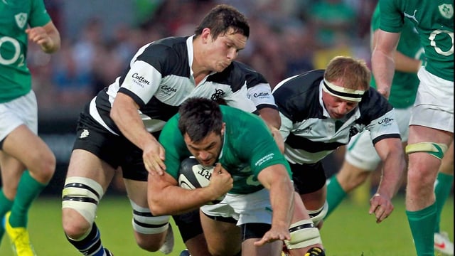 Ireland's Ronan Loughney tackled by Francois Louw and Mick O'Driscoll of Barbarians